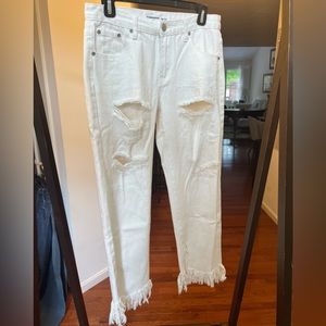 White ripped jeans with distressed bottoms